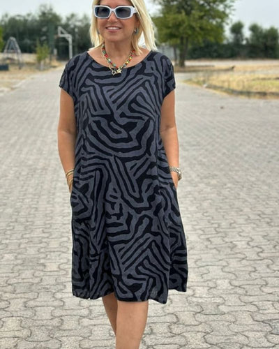 Nelia™ - Letní šaty s kulatým výstřihem a krásným potiskem