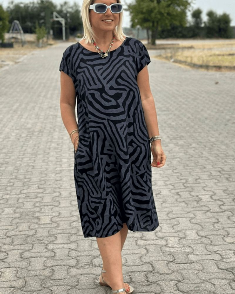 Nelia™ - Letní šaty s kulatým výstřihem a krásným potiskem